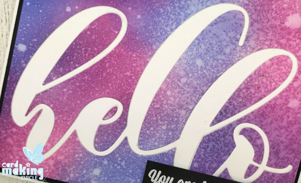 Inlaid die cutting made with the large Hello die from Altenew