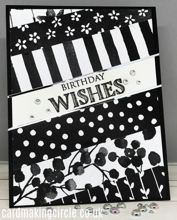 A "Birthday Wishes" card made with strips of black and white patterned paper.